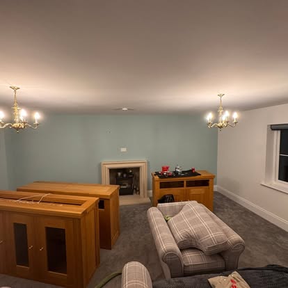 Living room in duck-egg green with fireplace