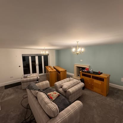 Living room painted duck-egg green with white woodwork