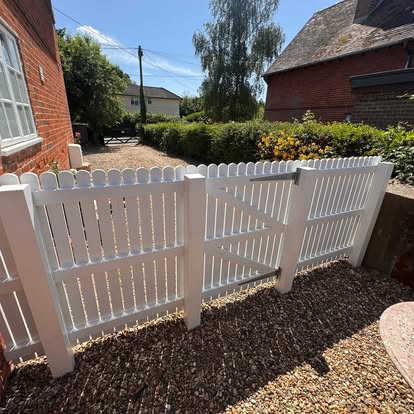 White picket gates painted at a period property
