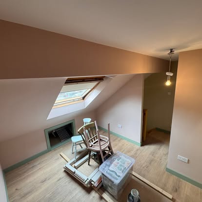 Loft bedroom with skylight in pale pink