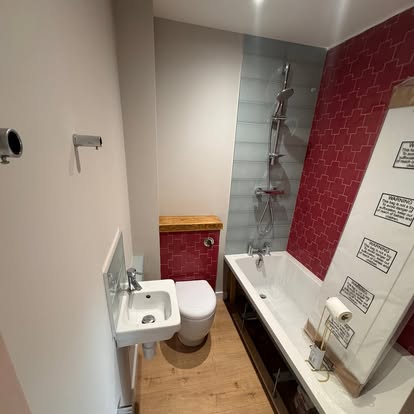 Bathroom with deep red feature wall