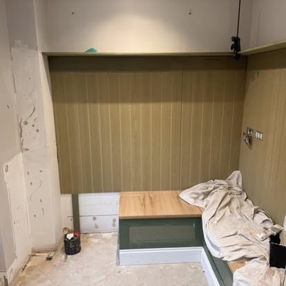 Panelled wall painted olive green