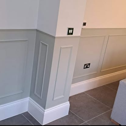 Grey panelling with white skirting