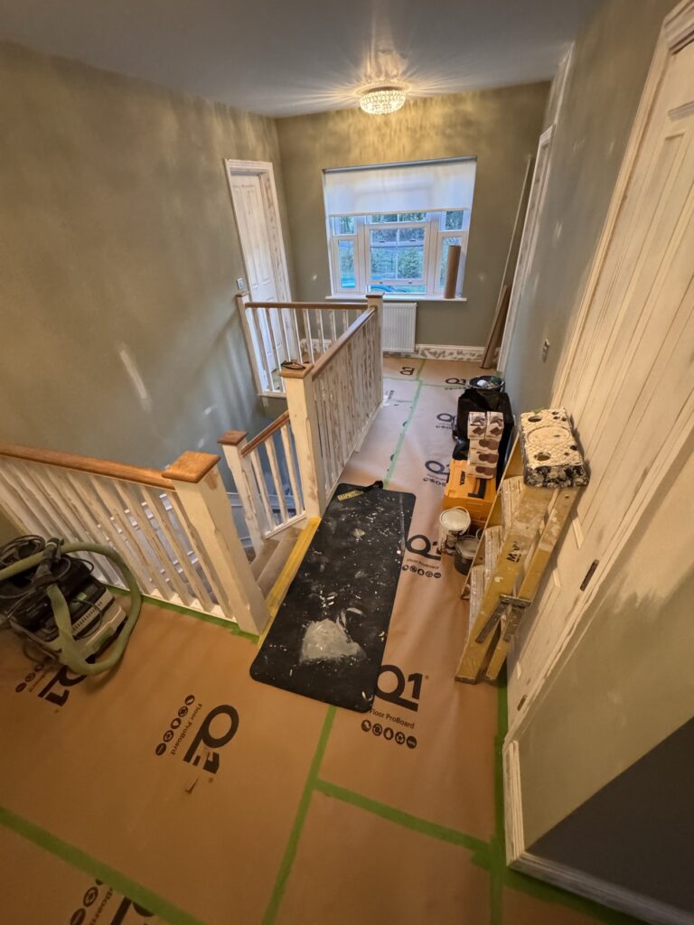 Landing floor protected with Q1 board and masking before painting