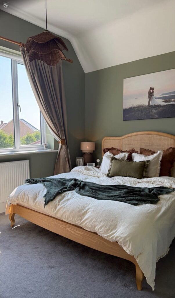 Bedroom painted soft sage green with white ceiling